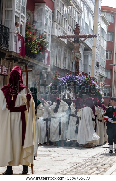 Ferrol,\
Galicia, Spain - 04/19/2019 Penitents carring the representation of\
Jesus Christ during the Easter procession\
