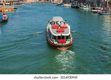 Ferry boat called Vaporetto in a canal of the Murano island, famous for the production of artistic glass, Venice Lagoon, UNESCO world heritage site, Veneto, Italy, Europe.