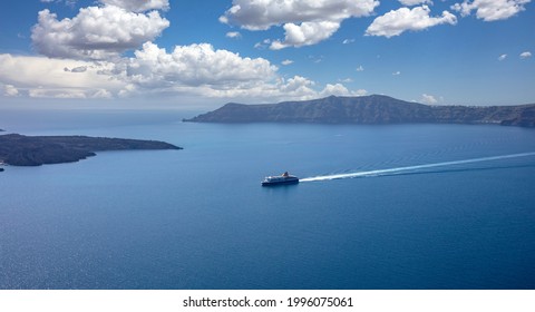 Ferry boat with destination Greek cyclades, Santorini island, Cyclades, Greece. Blue Aegean sea and sky background, summer vacation cruise travel tourism.
