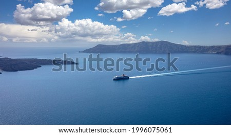 Ferry boat with destination Greek cyclades, Santorini island, Cyclades, Greece. Blue Aegean sea and sky background, summer vacation cruise travel tourism.