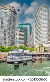 Ferry Boat Docked At Toronto Harbour Front With High Rise Buildings In The Background