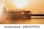 Ferry boat with passengers. Sunset on Marmara sea. Seafront near Istanbul, Turkey. High quality photo