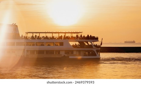 Ferry boat with passengers. Sunset on Marmara sea. Seafront near Istanbul, Turkey. High quality photo - Powered by Shutterstock