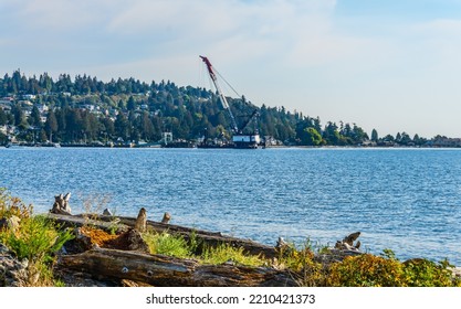 Ferry And Crane At The Terminal In West Seattle, Washington.