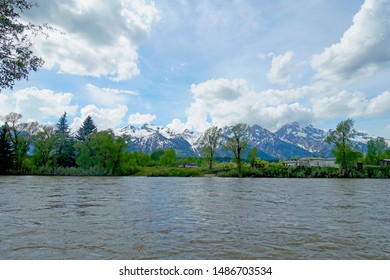        Ferry Crossing On Snake River Near The Teton Mountains In Wyoming, Taken From A Raft Trip.                        