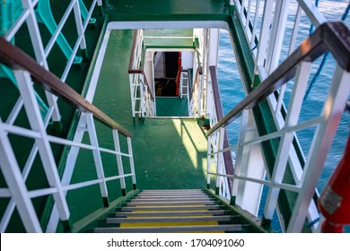 Ferry or cruise boat decks connected with stairs. Ferry deck upper and lower level. Budget travel option in South Asia. Tropical island hopping. Maritime vessel industrial interior. Sea travel concept