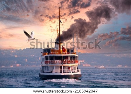 Ferry emitting large amount of black smoke. The ferry cruises in the Bosphorus. Ferry services in the Istanbul Bosphorus.
