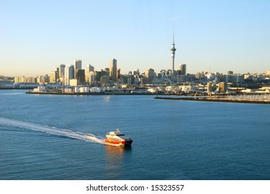 Ferry Passing By Auckland Harbor In Sunrise Light, New Zealand