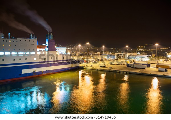 Ferry port at\
night during loading and\
boarding.