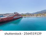 Ferry port at Thasos Island, Greece, with ferries docked and scenic mountain views in the background