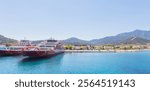 Ferry port at Thasos Island, Greece, with ferries docked and scenic mountain views in the background