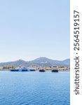 Ferry port at Thasos Island, Greece, with ferries docked and scenic mountain views in the background