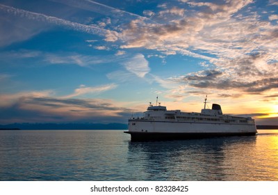 A ferry prepares to arrive at the harbor to pick up passengers for transportation - Powell River, British Columbia.