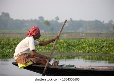 A Ferryman Of Majhi In Bengali Of West Bengal In Action