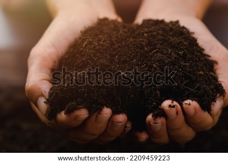 Fertile soil is in the hands of agriculture,The concept of abundance in the soil, preserving the environment,organic vegetable growing,ecological development,non-toxic agriculture,composting