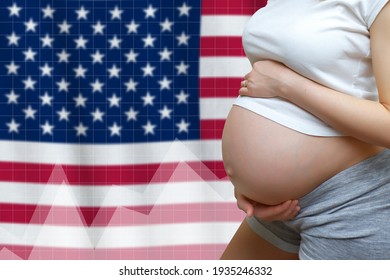 Fertility concept in USA. Pregnant woman on the background of the flag with graphs