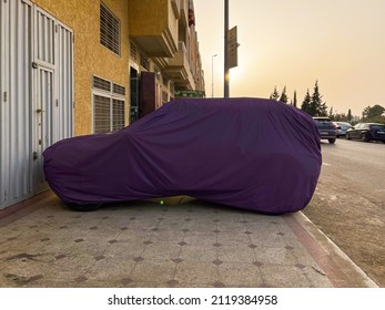 Fes, Morocco - January 16, 2022; Unrecognizable car covered with protective cloth outdoors