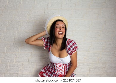 Festa Junina In Brazil, Known As Brazilian June Festival. Dark Tone Skin Older Woman In Typical Plaid Shirt And Straw Hat. Good Times And Happiness Concept.