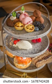 Festive Afternoon Tea With Sandwiches, Scones And Puddings