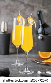 Festive Alcohol Cocktail Mimosa With Orange Juice And Cold Champagne Or Sparkling Wine In Glasses On Table.