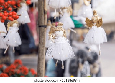 Festive angel ornaments, hanging decorations, white tulle dresses, Christmas holiday decor, star details, winter wonderland concept - Powered by Shutterstock