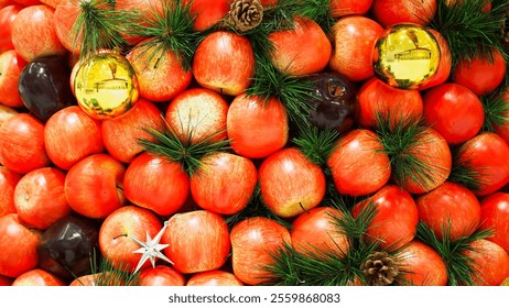 A Festive Apple Display Decorated with Green Pine Branches, Golden Ornaments, and Silver Stars - Powered by Shutterstock