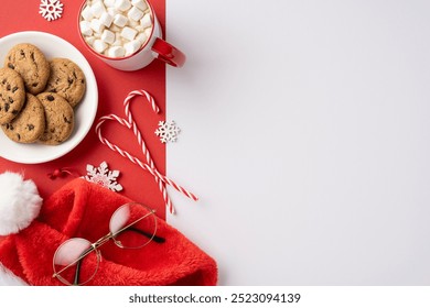 Festive arrangement featuring chocolate chip cookies, hot chocolate with marshmallows, and candy canes. Perfect for a Christmas theme representing holiday warmth and cheer - Powered by Shutterstock