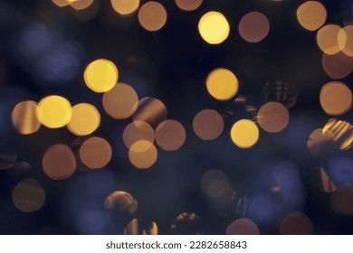 Festive backdrop fot your text or design. holiday illumination and decoration concept. Colorful defocused bokeh lights in blur night background. Defocused image.