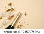 Festive background with bottle of champagne, glasses and confetti