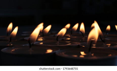 festive background burning candle, mourning photo of a blazing fire
