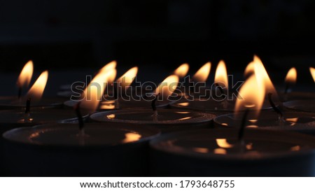 festive background burning candle, mourning photo of a blazing fire