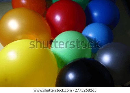 Festive background of multi-colored inflatable balls. Children's holiday. Decoration by air globs. Organization of holidays. Selling helium balloons.