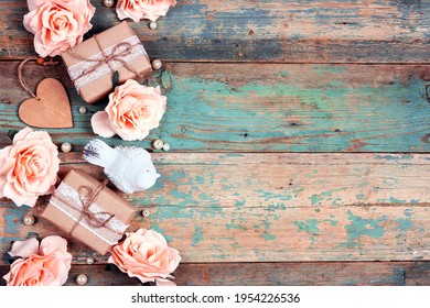 Festive background with rose flowers, gifts and bird on shabby wooden turquoise boards. Border top down composition with copy space. Valentine's Day, Mother's Day or 8 March greeting card. - Powered by Shutterstock