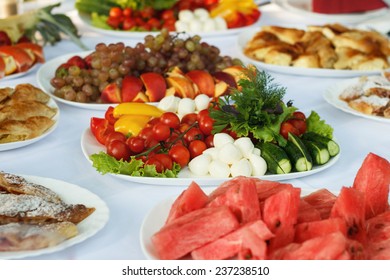 Festive banquet table with celebrate delicios food in restaurant - Shutterstock ID 237238510