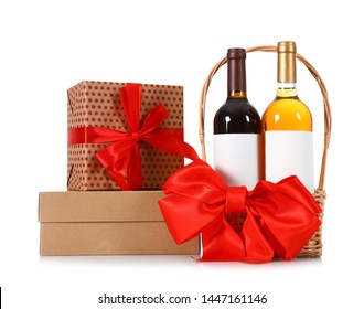 Festive Basket With Bottles Of Wine And Gift Boxes On White Background