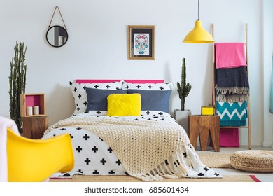 Festive bedroom of folk lover, mix of styles and materials