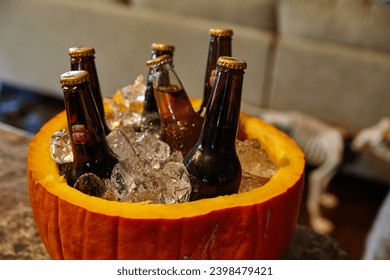 Festive Beer Chilling in Pumpkin Ice Bucket for Autumn Celebration - Powered by Shutterstock