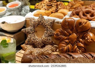 Festive bread display with star and wreath-shaped loaves, assorted holiday artisan breads, rustic bakery arrangement for holiday buffet - Powered by Shutterstock