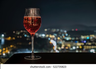 Festive Celebration Rose Wine, Cocktail, Champagne On Dark Stone Table Blurred Bokeh Background, Valentine Day,Christmas Festive Celebration.  Welcome To New Year 2022. Good Long Holiday Vacation.