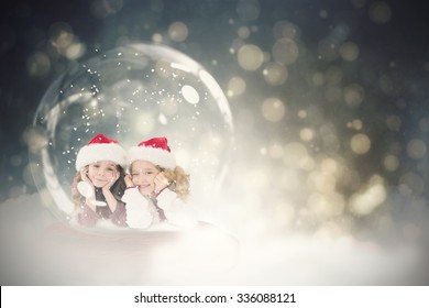 Festive child in snow globe against black abstract light spot design - Powered by Shutterstock