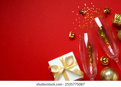 Festive Christmas background with champagne glasses, gift box, different decorations, balls and confetti on color background  - Powered by Shutterstock