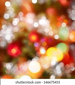 Festive Christmas background of defocused decorated xmas tree bokeh composition