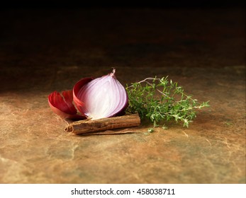 Festive Christmas Ingredients Of Red Onion, Thyme And Cinnamon For Spiced Bacon & Venison Cocktail Sausage Rolls