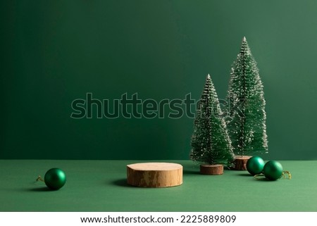Festive Christmas scene podium for products showcase, promotional sale, minimalist green background