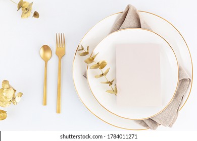 Festive Christmas, Wedding, Birthday Table Setting With Golden Cutlery And Porcelain Plate. Blank Card Mockup. Restaurant Menu Template. Flat Lay, Top View