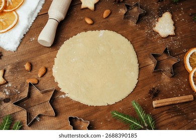 Festive cookie dough and baking setup on wooden table for christmas culinary and rustic food concept