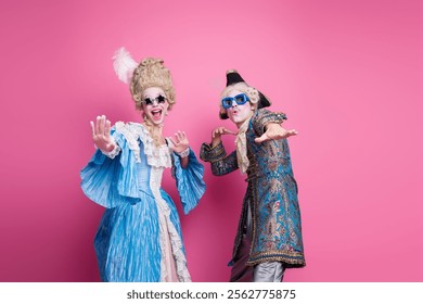 Festive couple in elaborate costumes with pink background embracing the joy of a masquerade theme party, showcasing historical fashion - Powered by Shutterstock