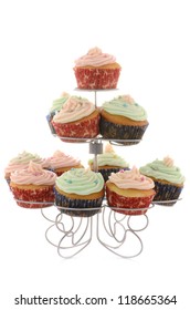 Festive Cupcakes On Metal Tiered Stand On White Background