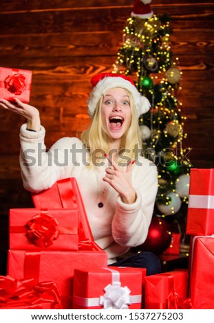 Festive decor. cheerful girl red santa hat. celebrate new year at home. xmas holiday gift. Boxing day. happy woman love presents. Winter shopping sales. last preparation. Christmas time.