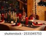 Festive dining table with Christmas setting in room